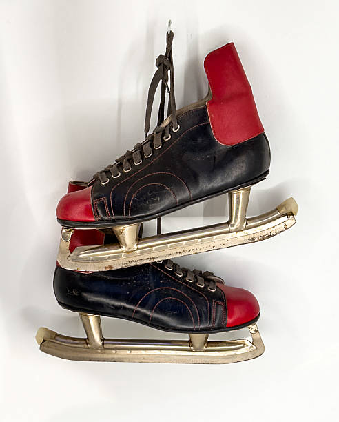 Vintage Black and Red Ice Skates on White Background