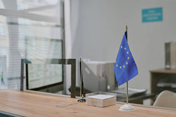 istock EU Flag on Desk in Modern Office Setting with Copy Space 2216120026