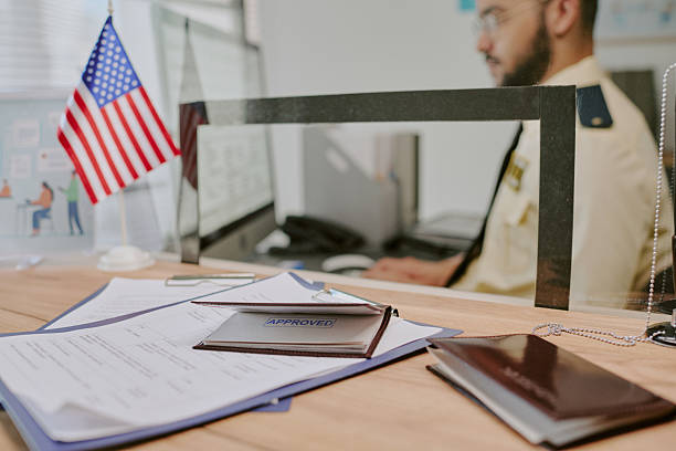 istock Approving Documents at Office Desk with American Flag 2216120904