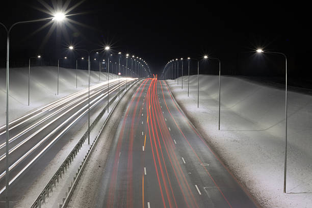 istock Winter Highway at Night Captured with Long Exposure Light Trails 2216120958