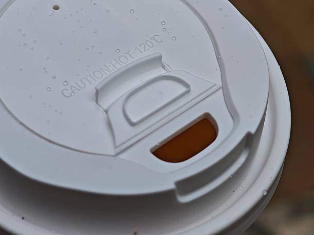 istock White disposable coffee cup lid with caution hot warning and condensation droplets 2216126502