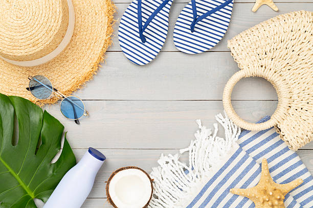istock Blue beach accessories on wooden background, top view. Copy space for text 2216126983