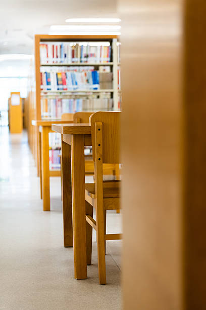 istock Public library with wooden tables and chairs 2216129141