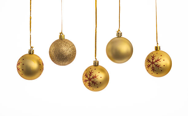 istock Golden Christmas balls hanging in a row 2216129422