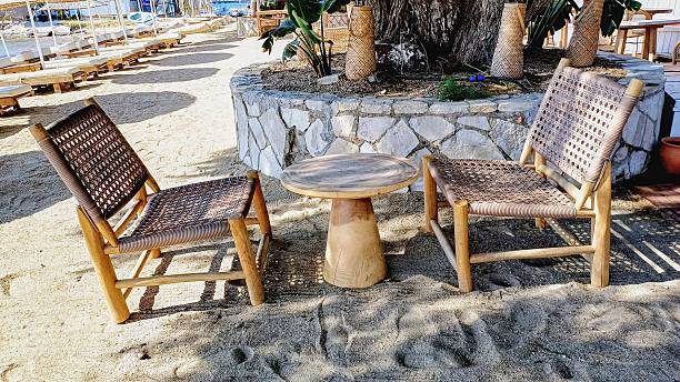 istock Empty tables and chairs standing by the sea 2216133641
