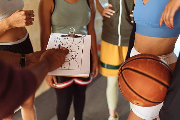 istock Focused Female Basketball Team Huddles for Strategy 2216133920