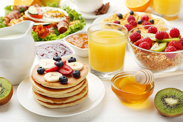 istock Tasty breakfast on white wooden table 2216136654
