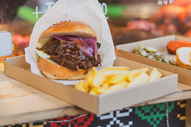 Gourmet hamburger with vegetables in a street food stall