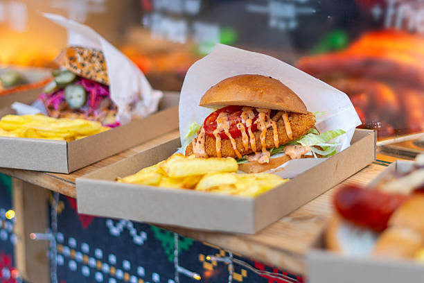 Gourmet hamburger with vegetables in a street food stall