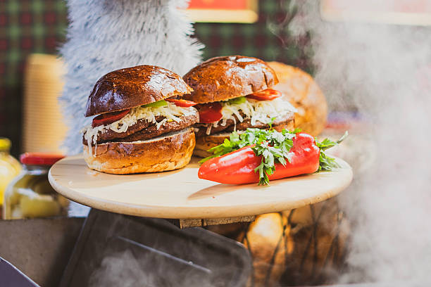Gourmet hamburger with vegetables in a street food stall