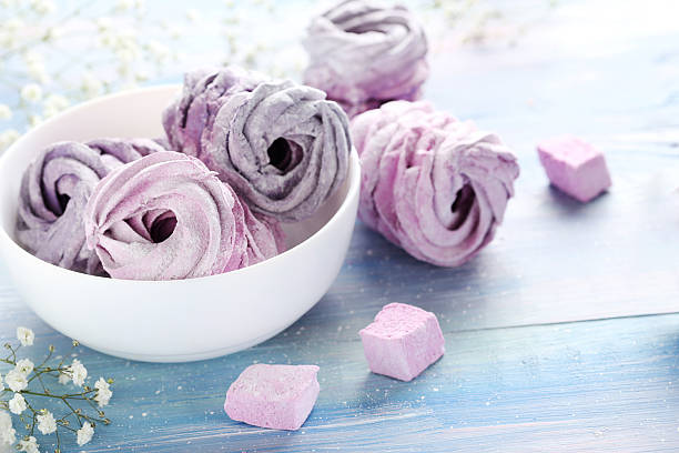 istock Sweet zephyr in bowl on blue wooden table 2216137739