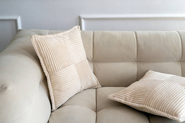 istock Elegant white modern interior with a comfortable couch and decorative pillows 2216139987