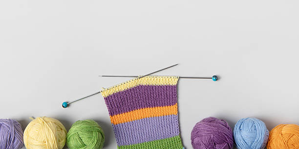istock Ball of thread with knitting needles and knitted fabric 2216140152