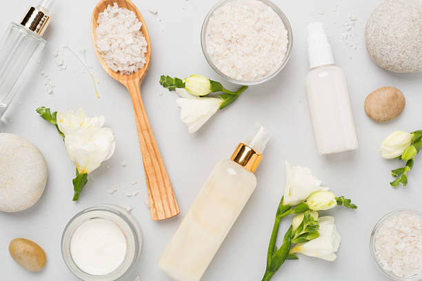 istock Flat lay with spa products and flowers on color background 2216140222