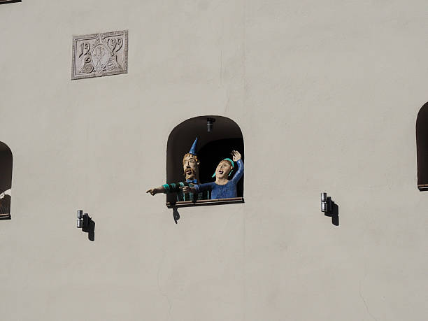 Toru, Poland - August 7, 2018: building with different figures in the window niches