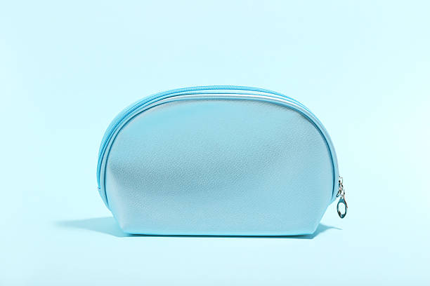 istock Makeup bag on blue background. Minimalism concept 2216144953