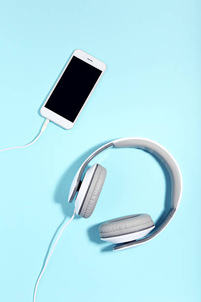 istock Headphones and smartphone on blue background. Minimalism concept 2216145274