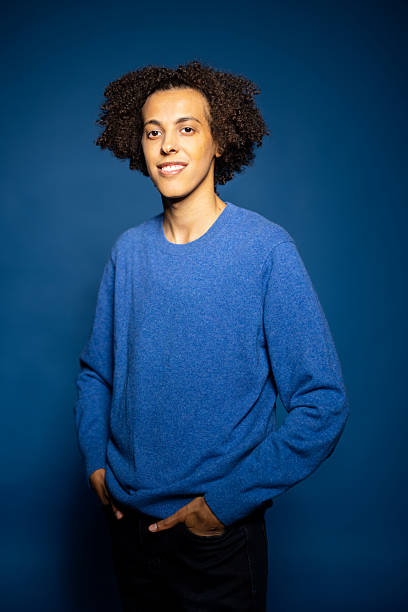 istock Middle Eastern man with hands in pockets posing against blue background 2216146428