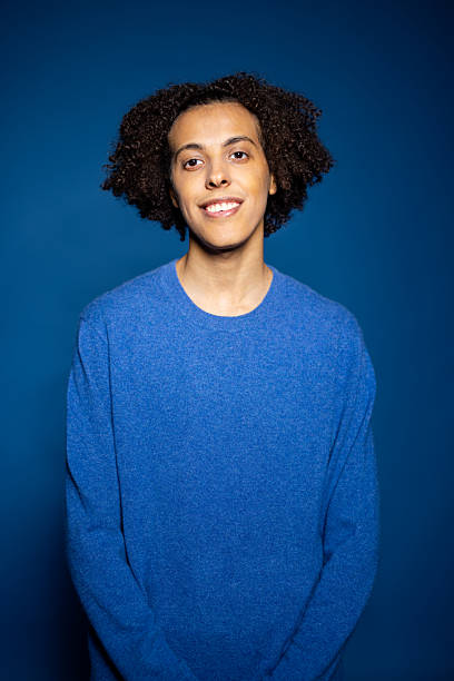 istock Middle Eastern man wearing a blue t-shirt smiling against blue background 2216146432