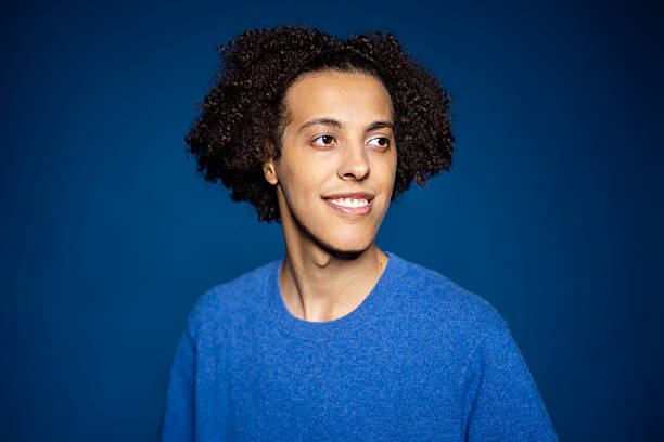 istock Middle Eastern man glancing to the side against blue background 2216146443