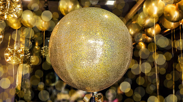 istock Golden balloons on bokeh background. 2216146896