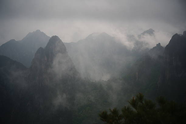 The mountaintop covered in clouds and mist