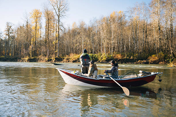 istock Young couple on guided drift fishing trip on river 2216149828