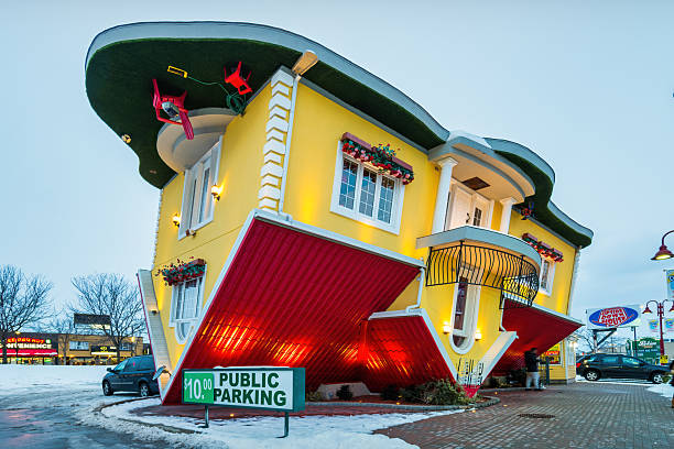 The Upside Down House, an attraction in Clifton Hill entertainment district, in downtown Niagara Falls, Ontario, Canada in the evening.