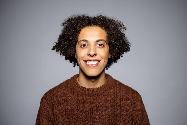 istock Middle Eastern man smiling at the camera against gray background 2216151705