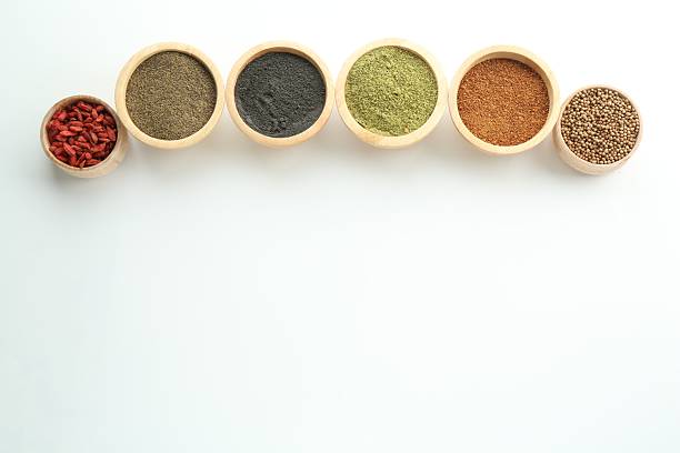 istock Different superfood powders in bowls on white background, flat lay. Space for text 2216152479