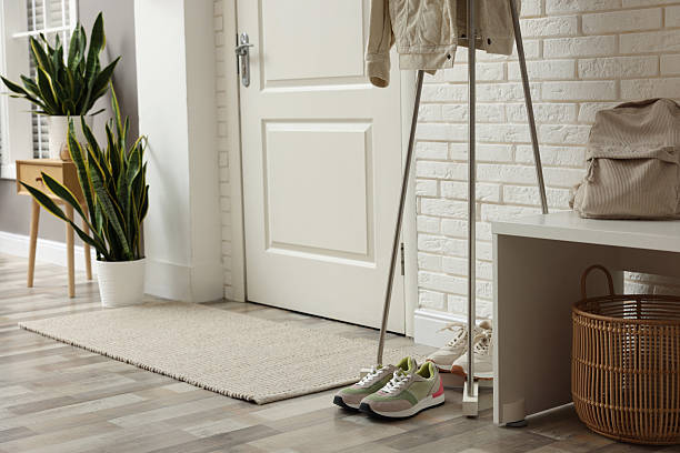 istock Metal rack with jacket and sneakers in hallway 2216153526