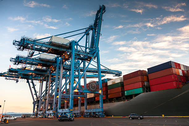 istock Large Cargo Ship Parked on Container Terminal in Tacoma, Washington at Sunrise 2216153777