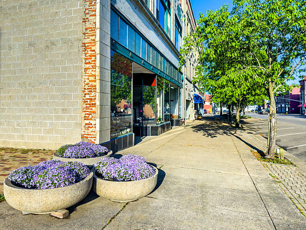 istock Walk Back in Time:  A Look Down a Rural Main Street Sidewalk with Stores 2216158919
