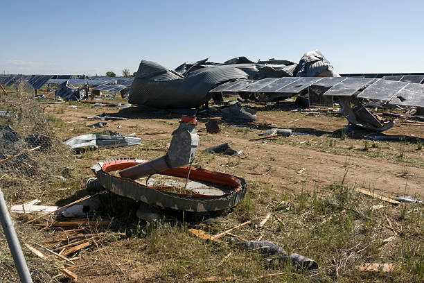 Solar panels, punctured, pulverized, folded and shattered by an EF2 tornado on May 18, 2025 remain where they fell on a solar farm in west Bennett, Colorado on May 20, 2025.