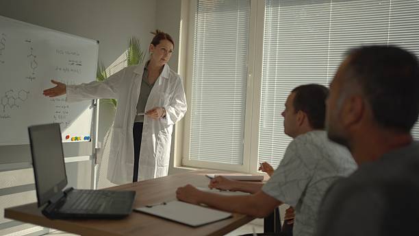 istock Woman Leading Presentation In Front Of An Audience 2216161536