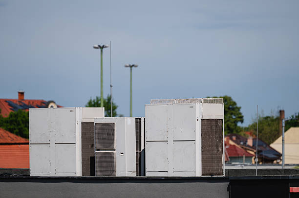istock Rooftop industrial air conditioning units on commercial building 2216162965