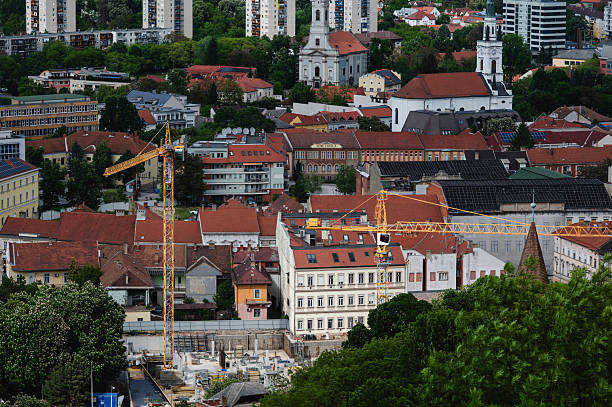 istock Cityscape with historic buildings and construction cranes 2216163025