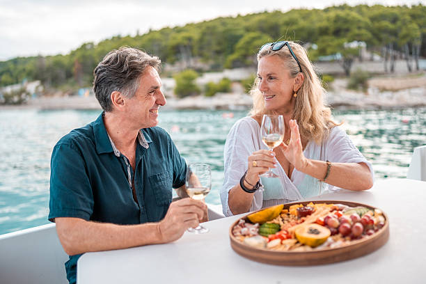istock Mature Couple Enjoying Wine on Adriatic Boat 2216163341