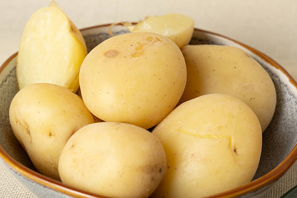 istock Bowl of freshly washed potatoes ready for cooking 2216164460