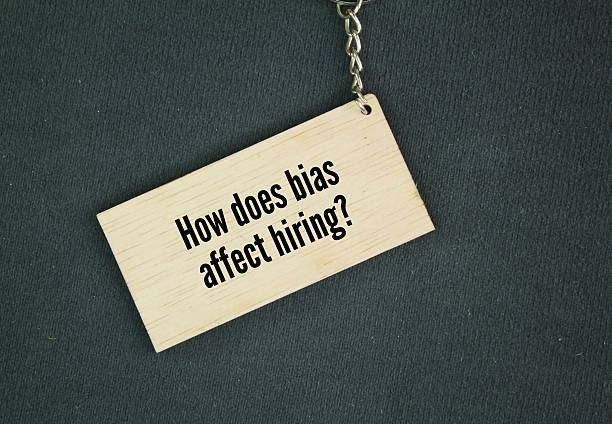 istock Wooden tags with question words How does bias affect hiring? 2216165117