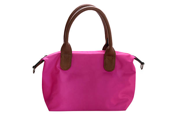 istock Bright pink bag with leather handles isolated on white background 2216169952