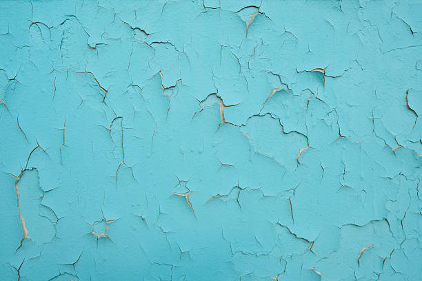 istock Old wall with peeling blue paint. Cement wall exterior background with blue paint peeling. 2216170010