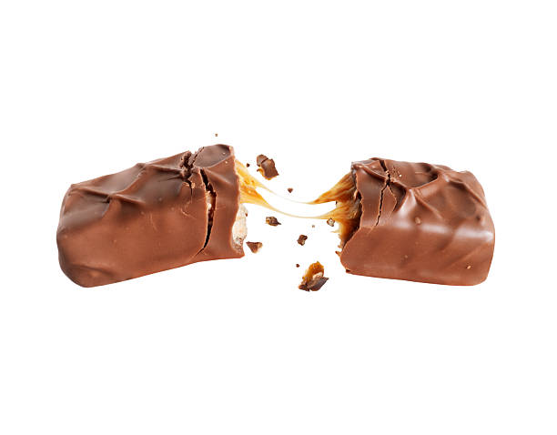 istock Chocolate bar broken into two halves with stretched filling 2216170286