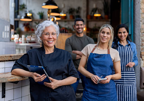 istock Food service employees working at a restaurant and smiling 2216171041