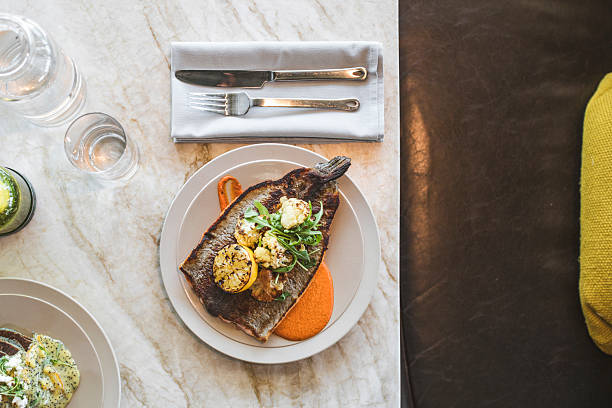 istock Overhead view of fish dish plated and served 2216173956