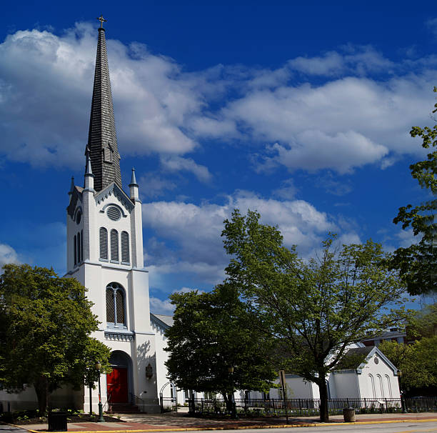 istock St. John's episcopal church rising towards a cloudy blue sky 2216174332