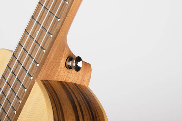 istock Ukulele made of light precious wood on a white background. isolated object. close-up.side view 2216178976