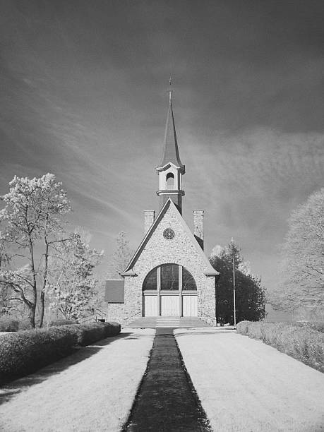 Built in 1922, with funds raised from Acadian communities throughout North America, the Memorial Church symbolizes the spirit of Acadian nationalism. Photographed in infrared light.