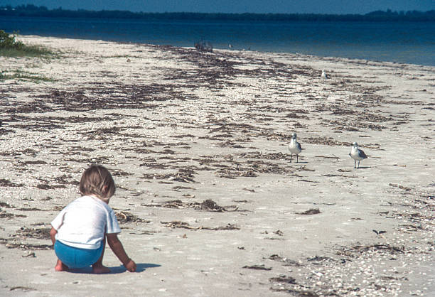 Sanibel Island - Playing in the Sand - 1981. Scanned from Kodachrome 64 slide.