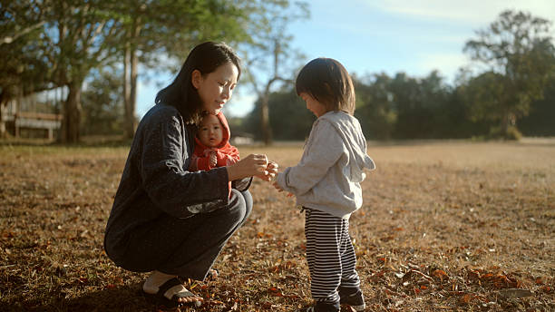 A little child is enjoying herself in her backyard.